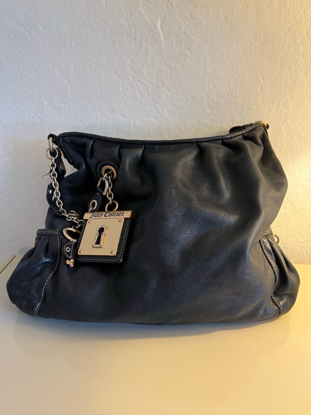 Juicy Couture Black Leather Shoulder Bag with Lock Charm Accent